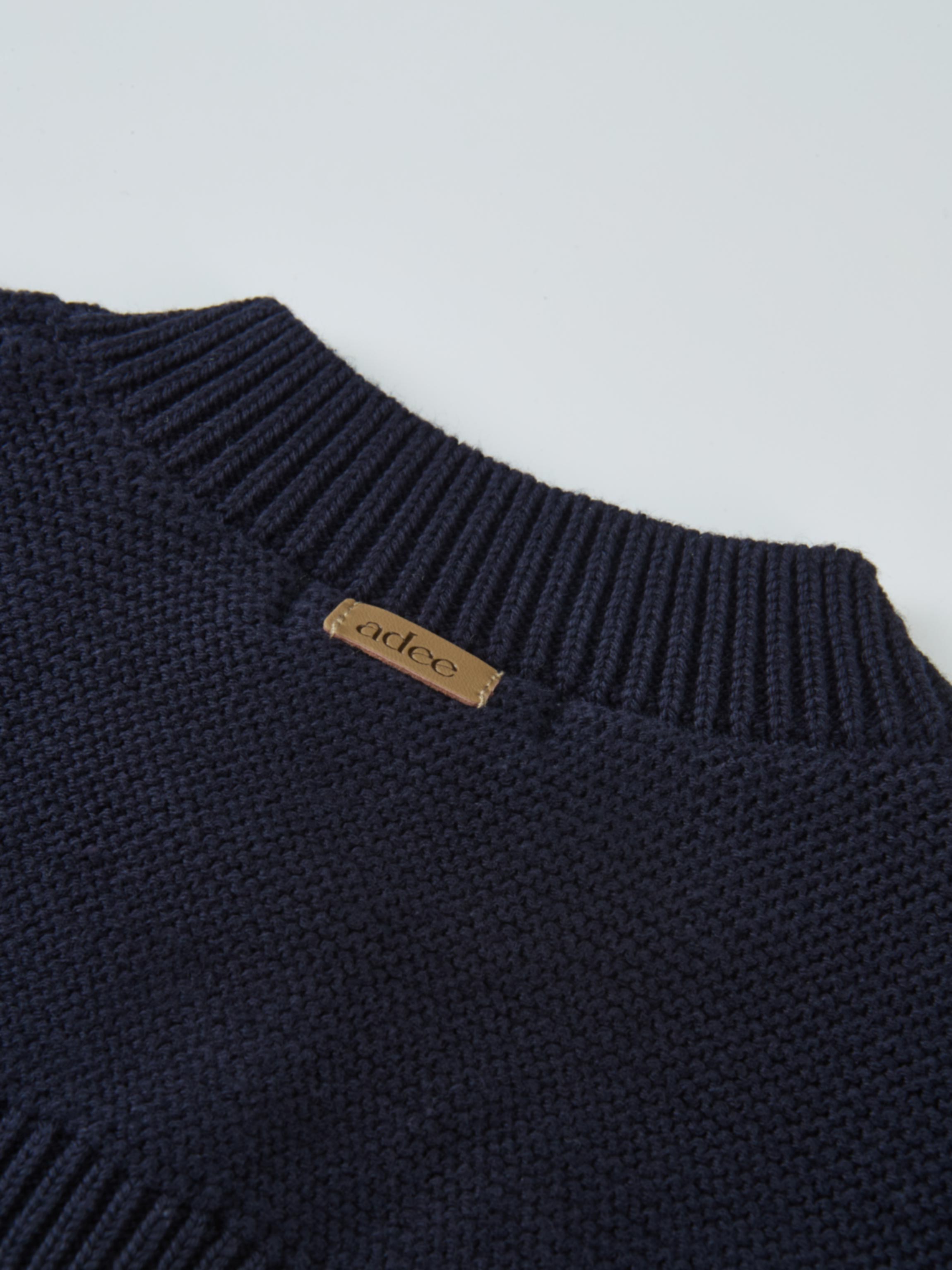 Cropped Cardigan by Adee in navy knit, ribbed neckline with tan leather brand tag