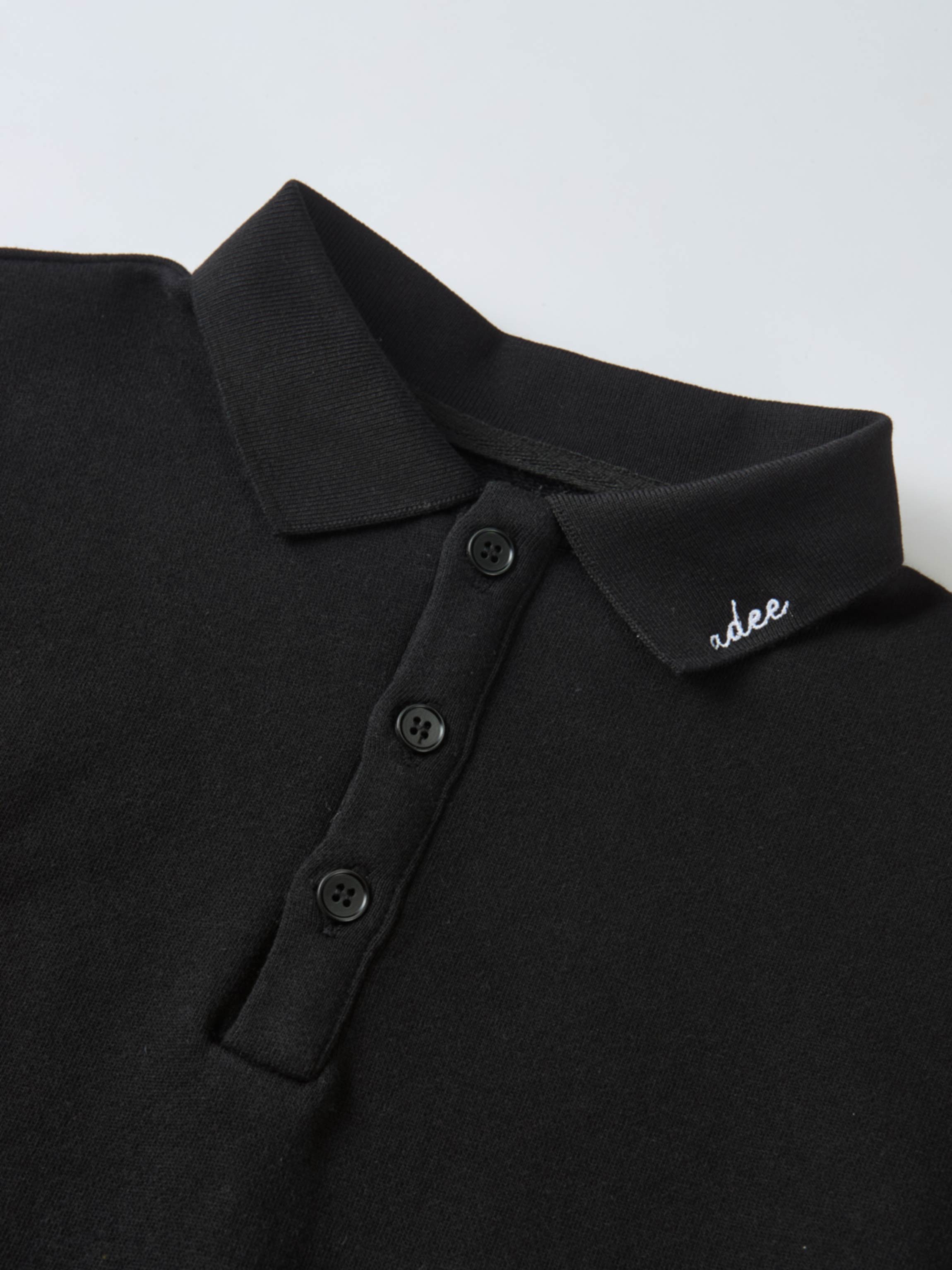 Collared black Adee polo-style sweatshirt, unisex top, with button placket and collar logo embroidery