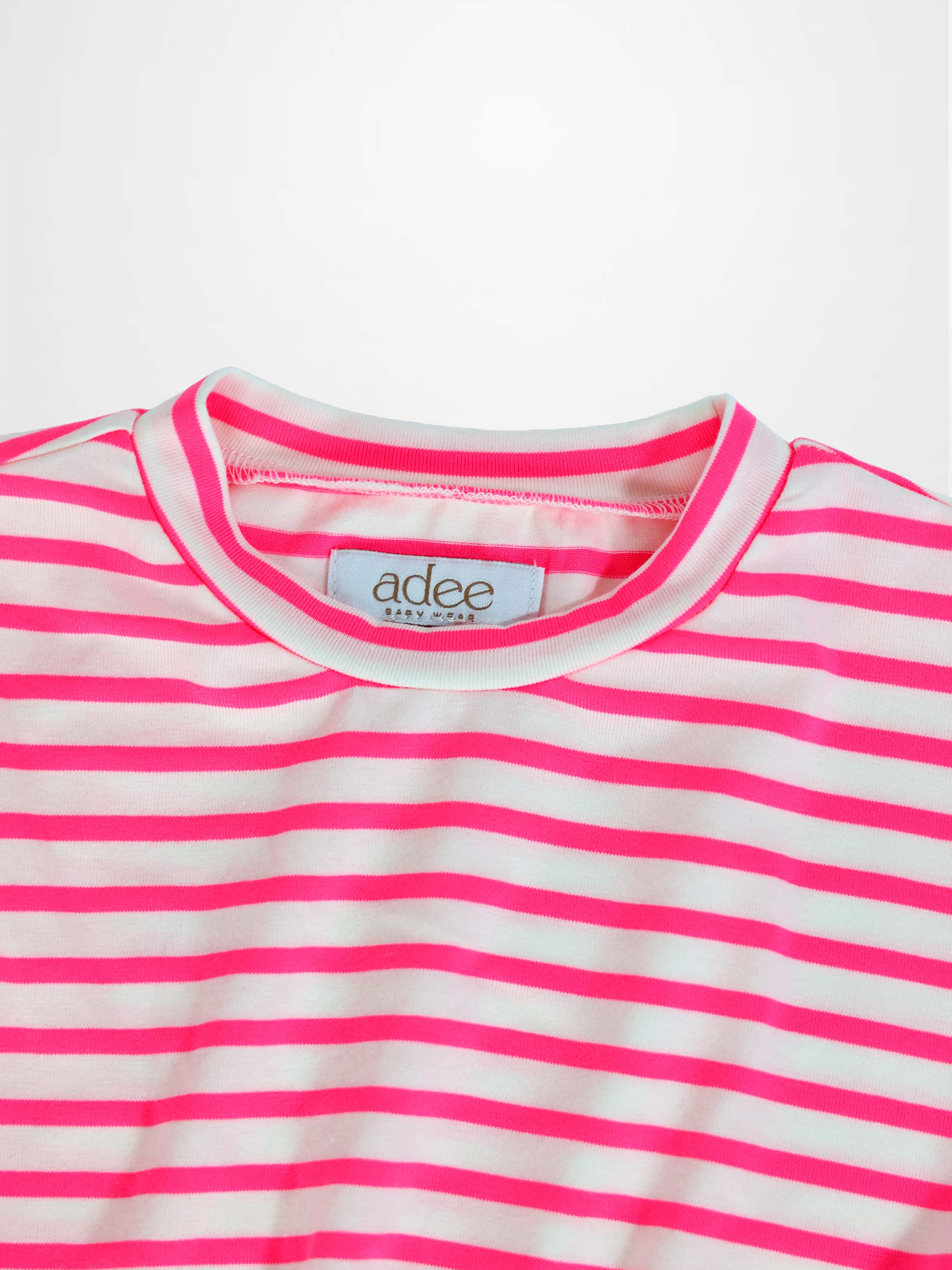 Neon pink and white striped baby dress bodice with a round ribbed neckline.