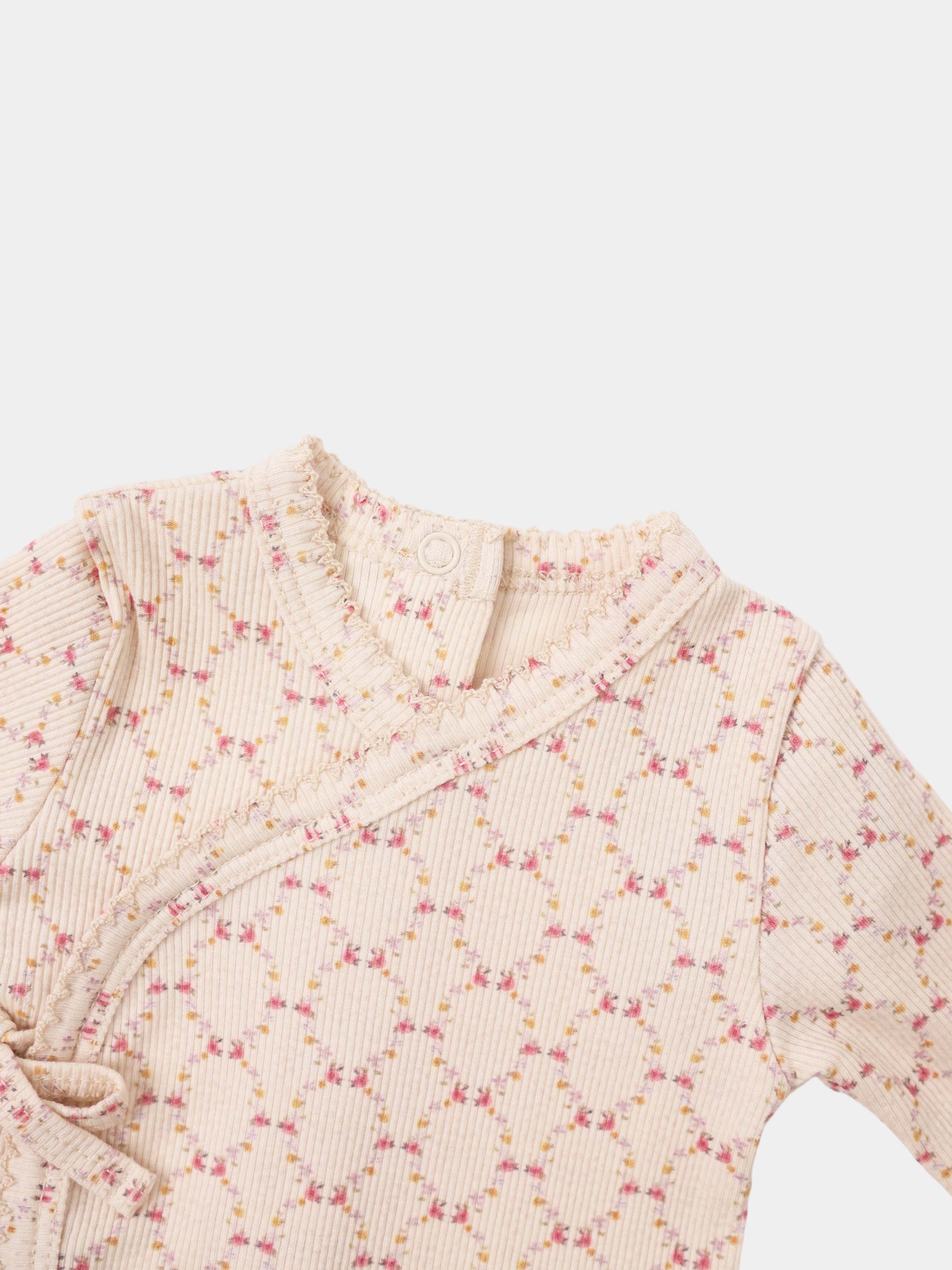 Adee Floral Garland layette set; pale pink ribbed knit with tiny pink and yellow flowers and ruffled edges.