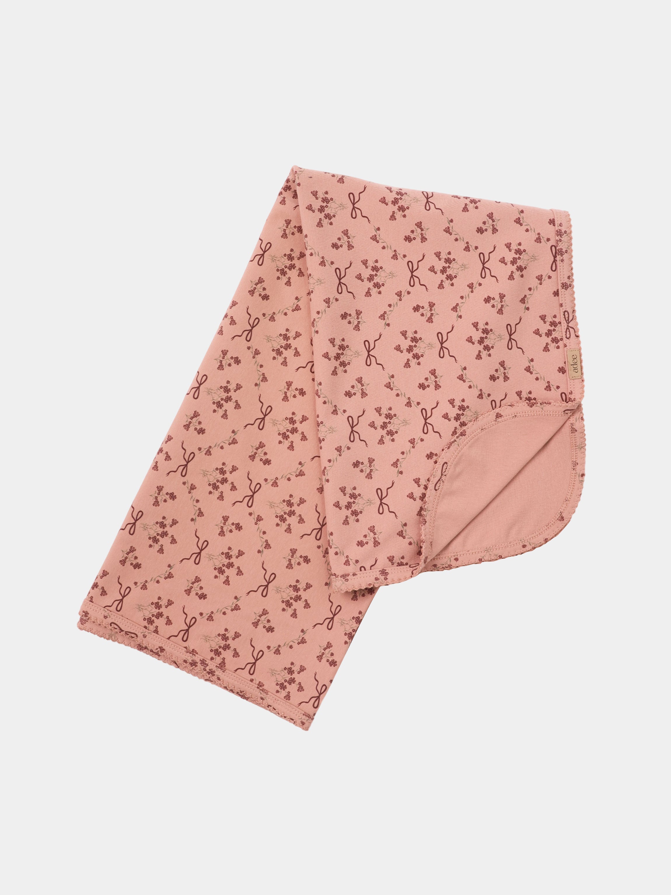 Bow Bouquet Layette Set by Adee in pink with tiny floral prints and bow motifs.