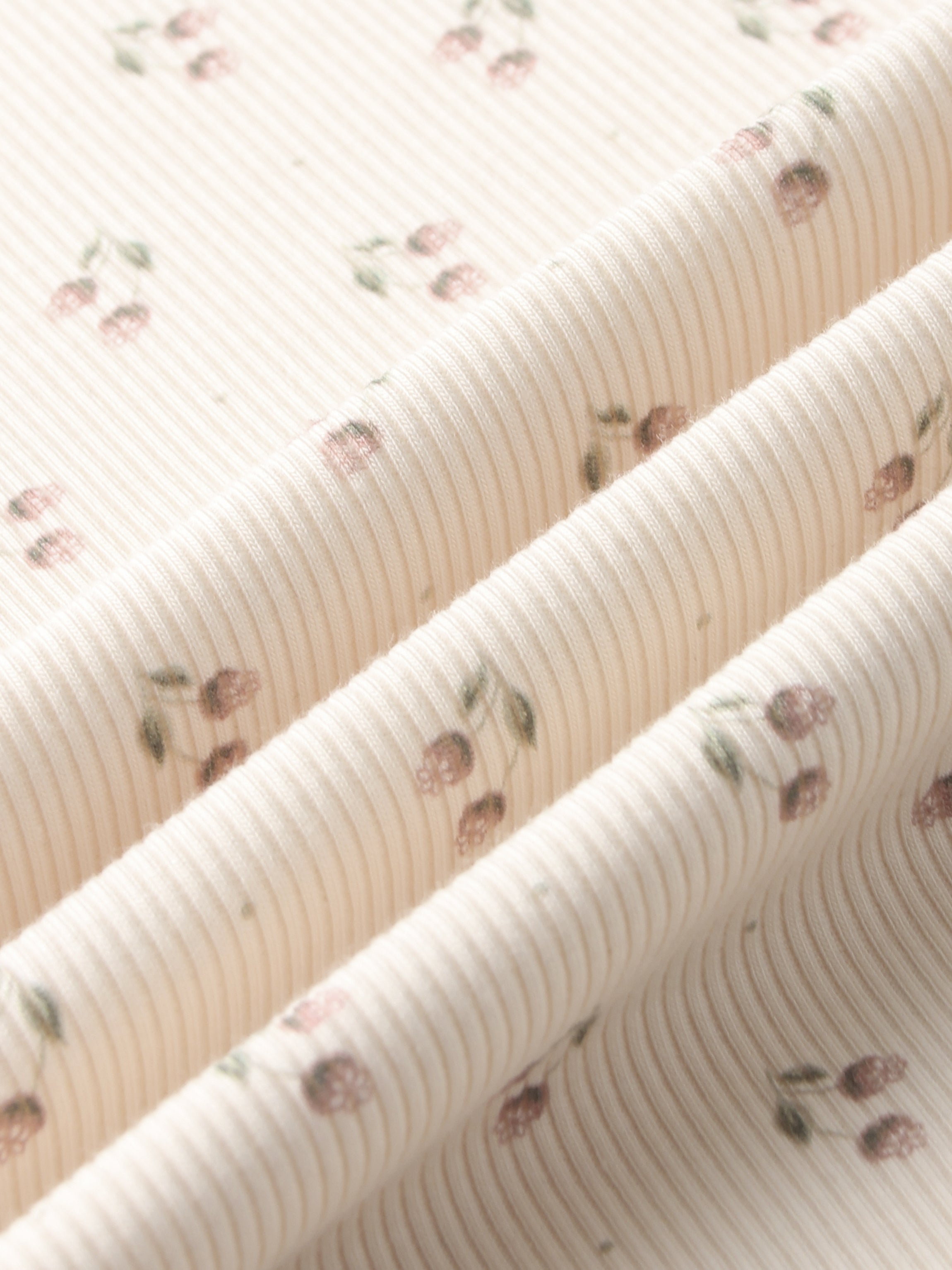 Tiny Tulip layette set fabric by Adee, pale pink striped knit with tiny pink tulip motifs