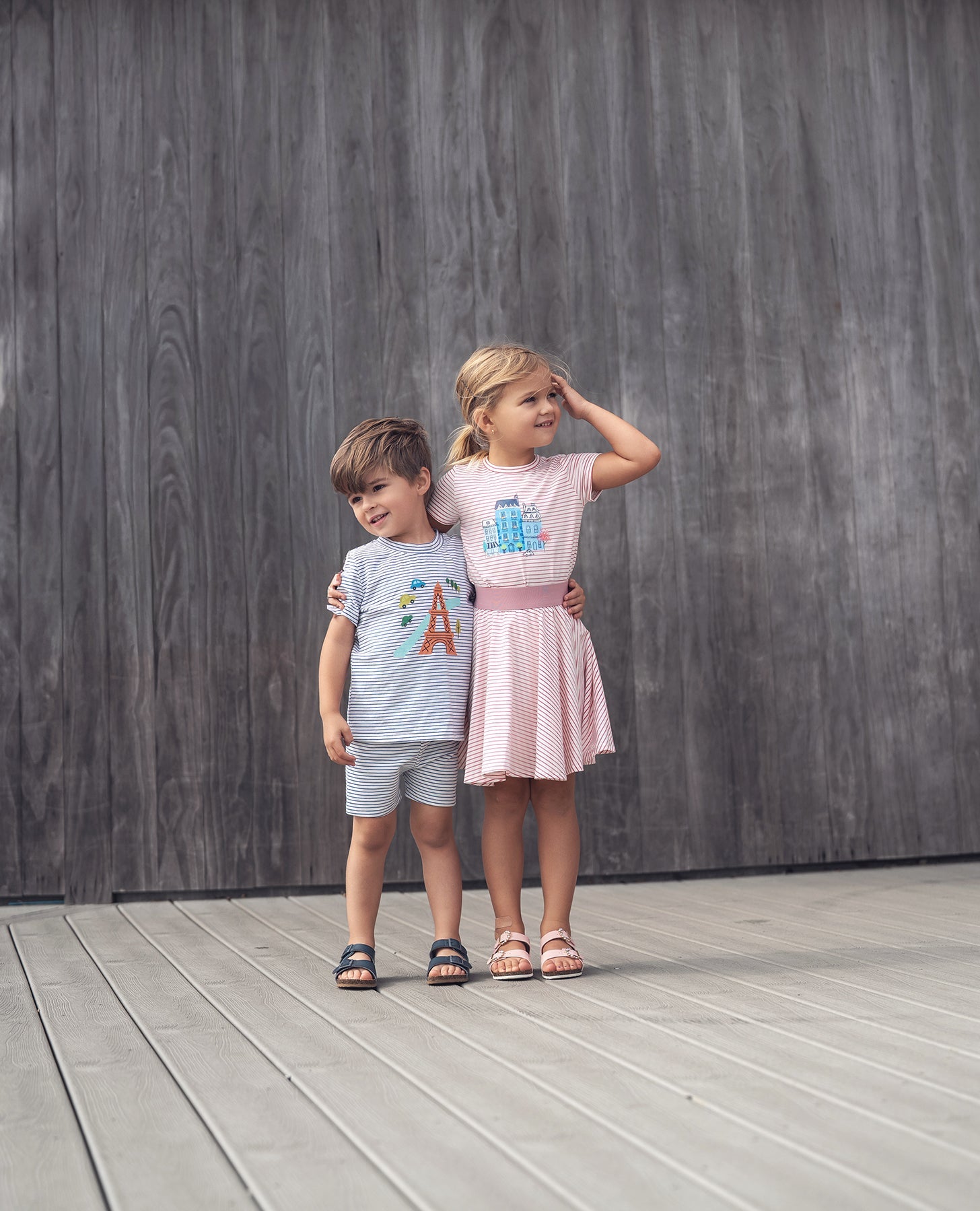 Striped Pink Skirt for girls by Adee; two children in matching striped outfits pose against a wooden backdrop.