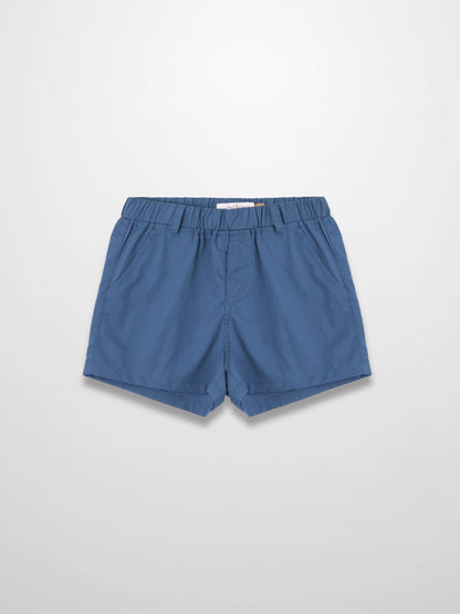 Blue cotton shorts with elastic waistband, laid flat.