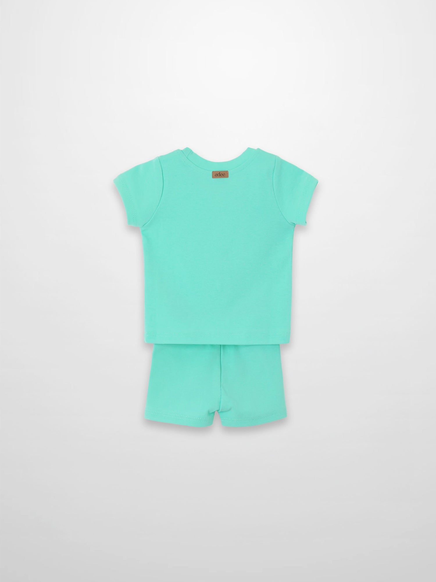 Mint green short-sleeve boxy T-shirt and shorts set, back view.