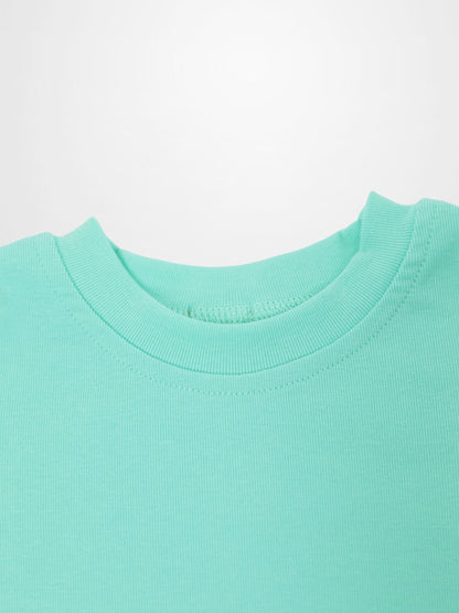 Mint green short-sleeve boxy T-shirt neckline close-up