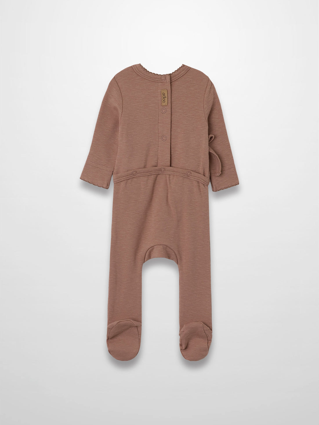 Dusty pink scalloped stretchy baby girl jumpsuit footie with side crossover detail.