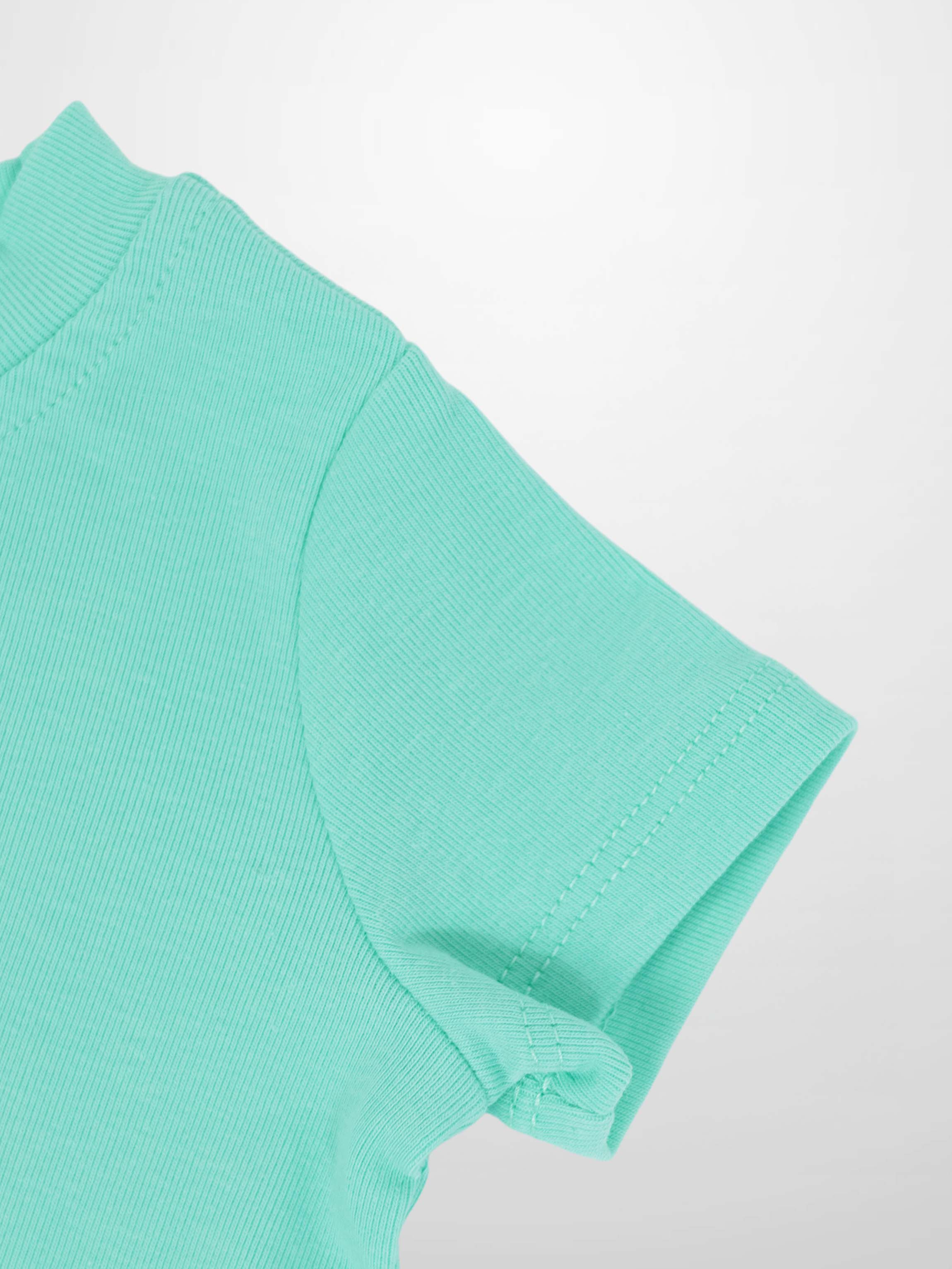 Mint green short-sleeve boxy T-shirt close-up showing sleeve seam.