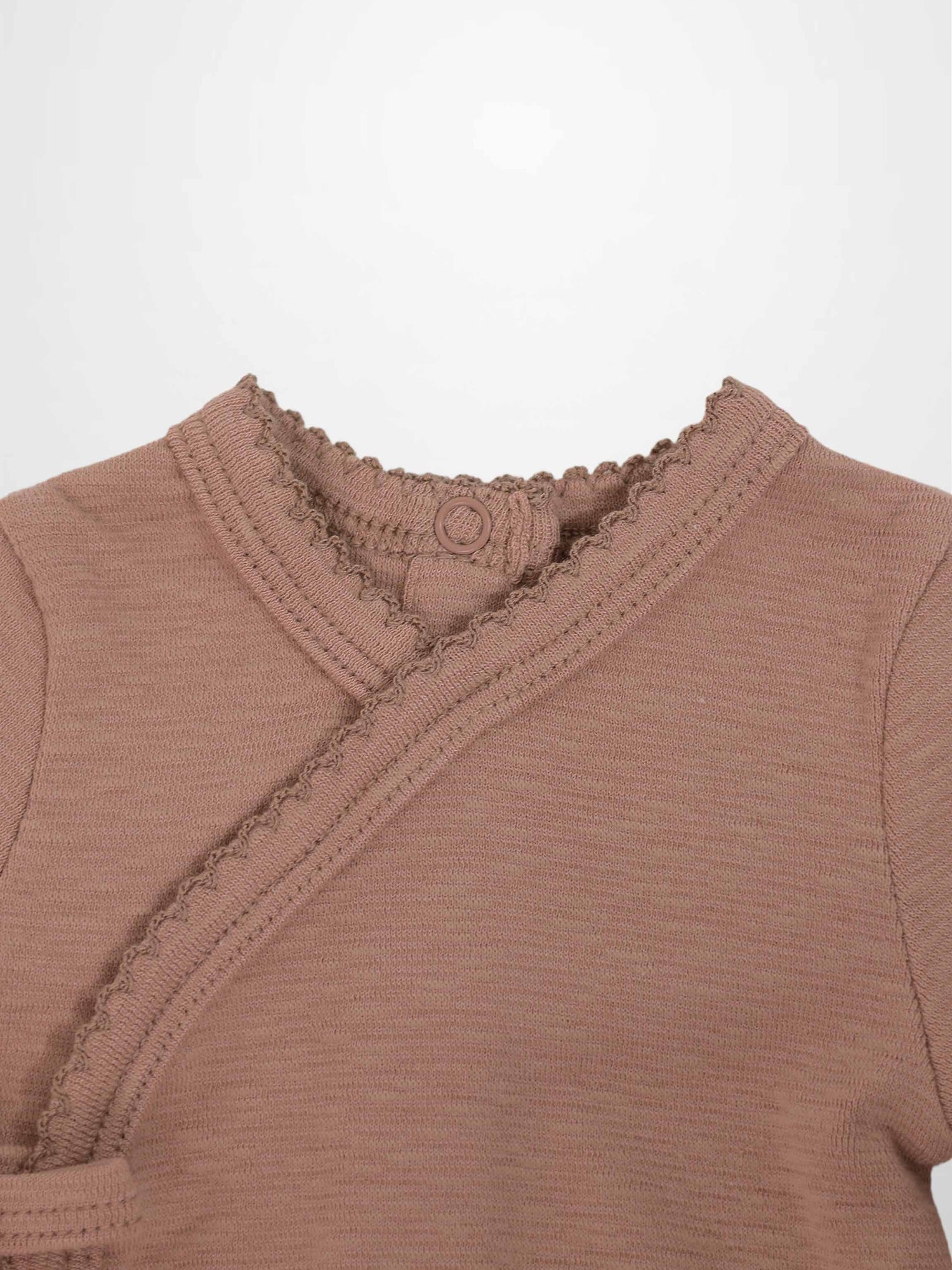 Pink Scalloped Stretchy baby jumpsuit top in dusty pink with a crossover wrap and scalloped trim.