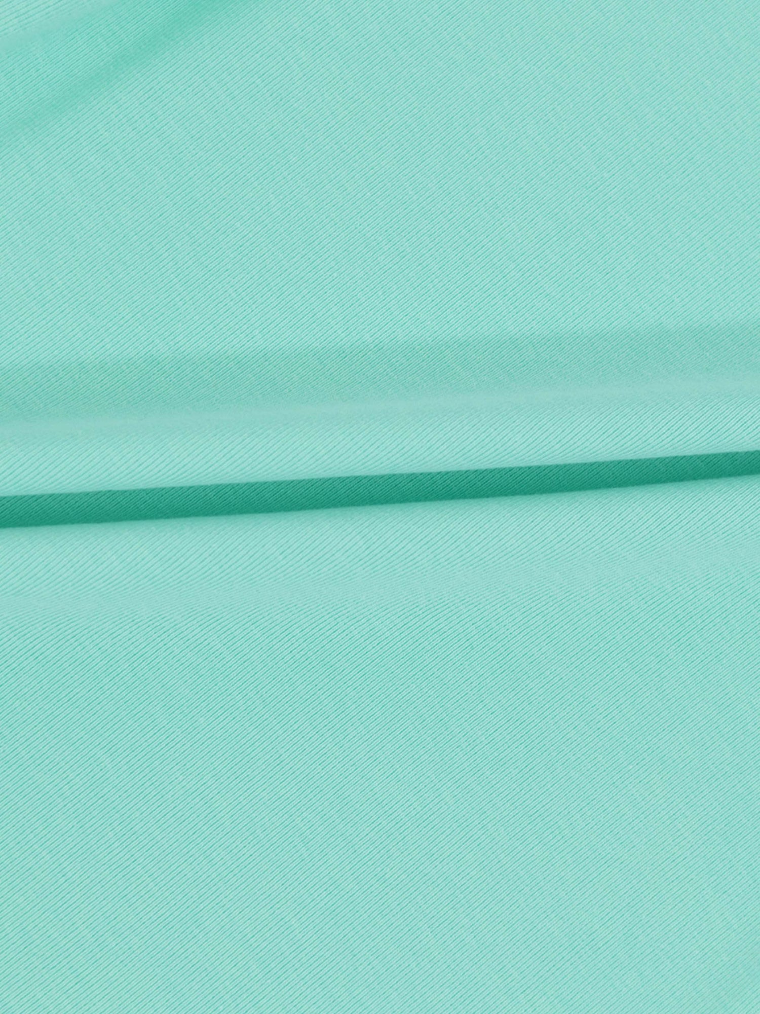 Mint green fabric with soft folds for a 6-panel skirt.