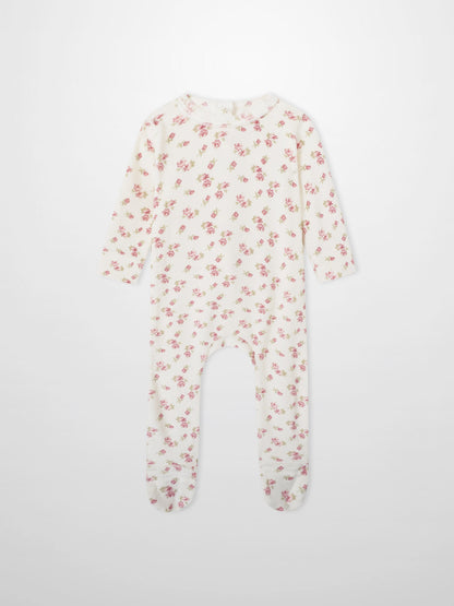 Tiny Blossom layette set sleeper, cream fabric with pink floral print, long-sleeve and footed.