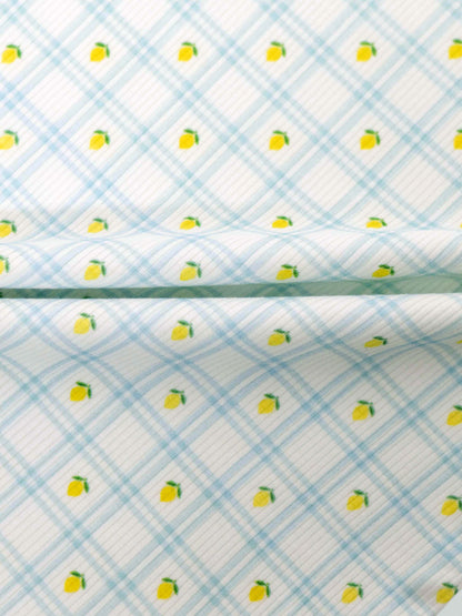 Lemon Window Stretchy fabric: white base with light blue grid plaid and tiny yellow lemons scattered.