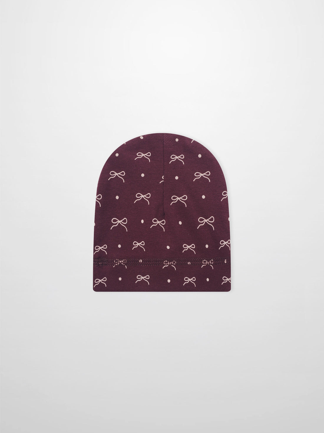 Girls burgundy bow hat with white bow and dot pattern on knit fabric