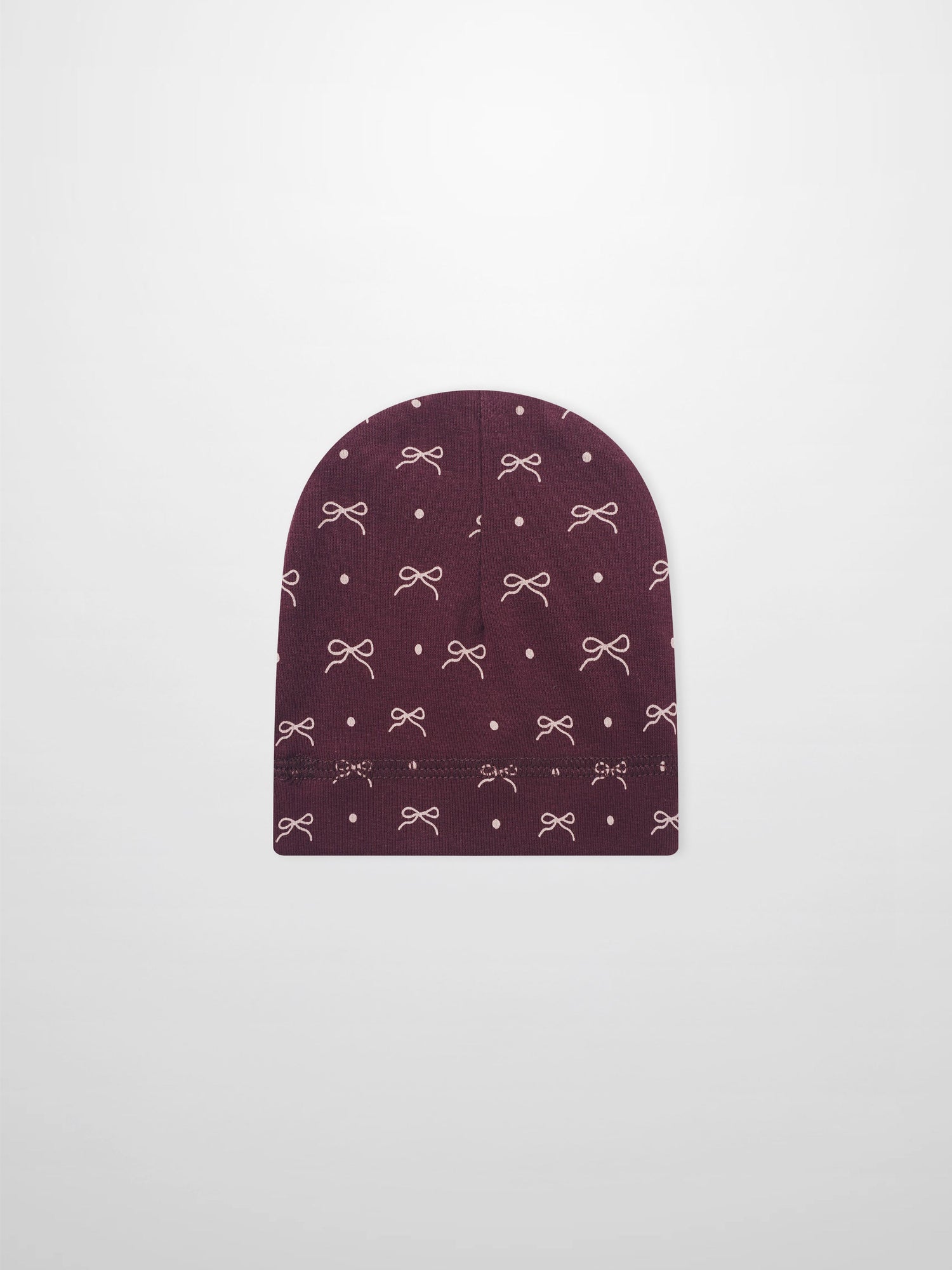 Girls burgundy bow hat with white bow and dot pattern on knit fabric