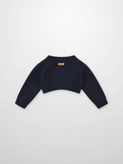 Cropped cardigan navy by Adee; unisex dressy knit with ribbed hem and cuffs.