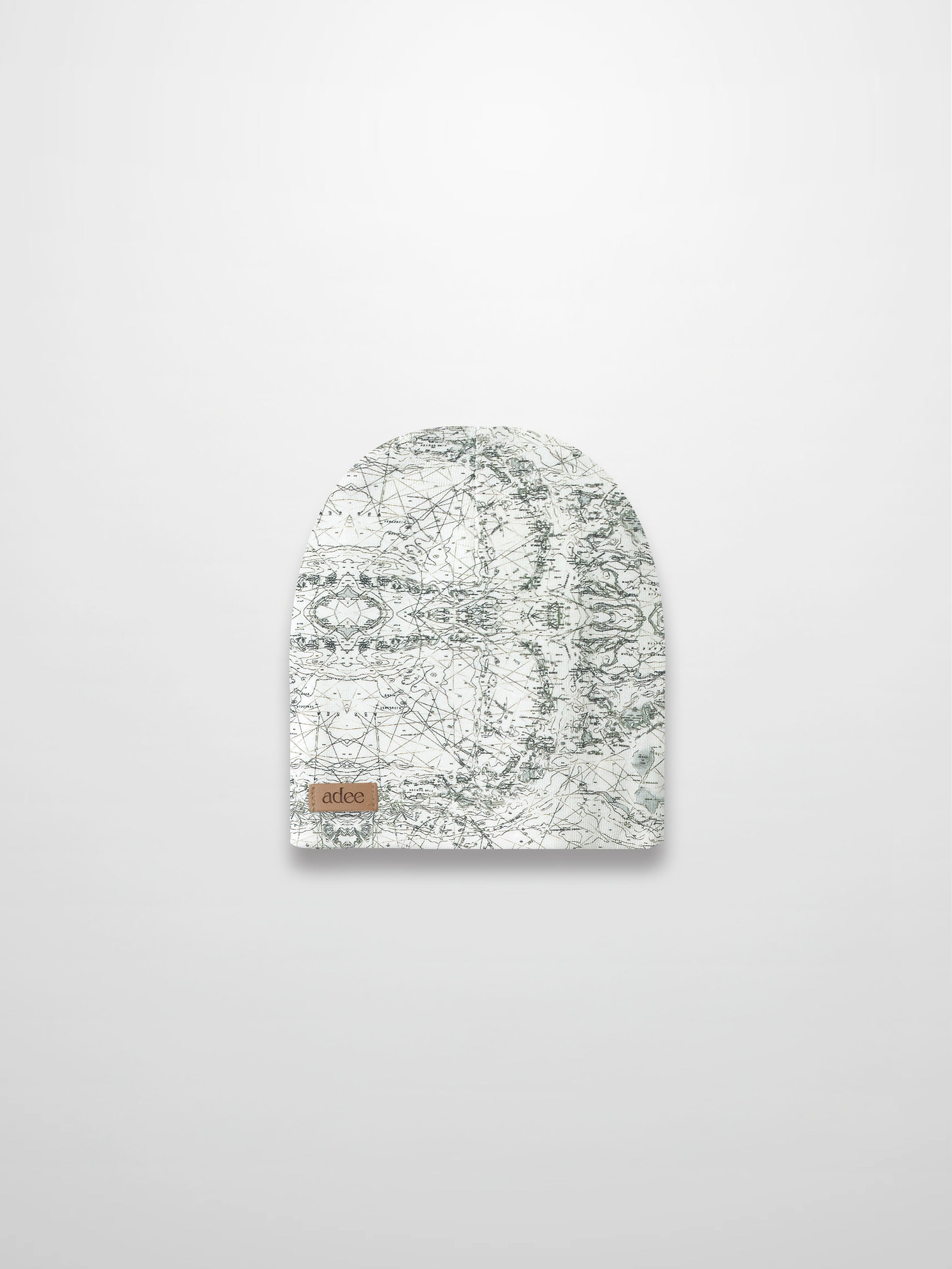 Map Beanie: off-white baby beanie with sketched map print, grey lines, compass markers and decorative stitching.
