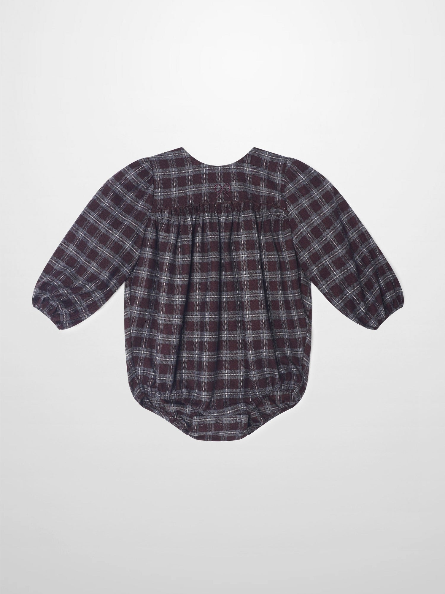Plaid burgundy girls romper, dressy style with puff sleeves and gathered back waist.