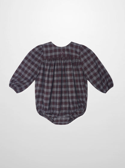 Plaid burgundy girls romper, dressy style with puff sleeves and gathered back waist.