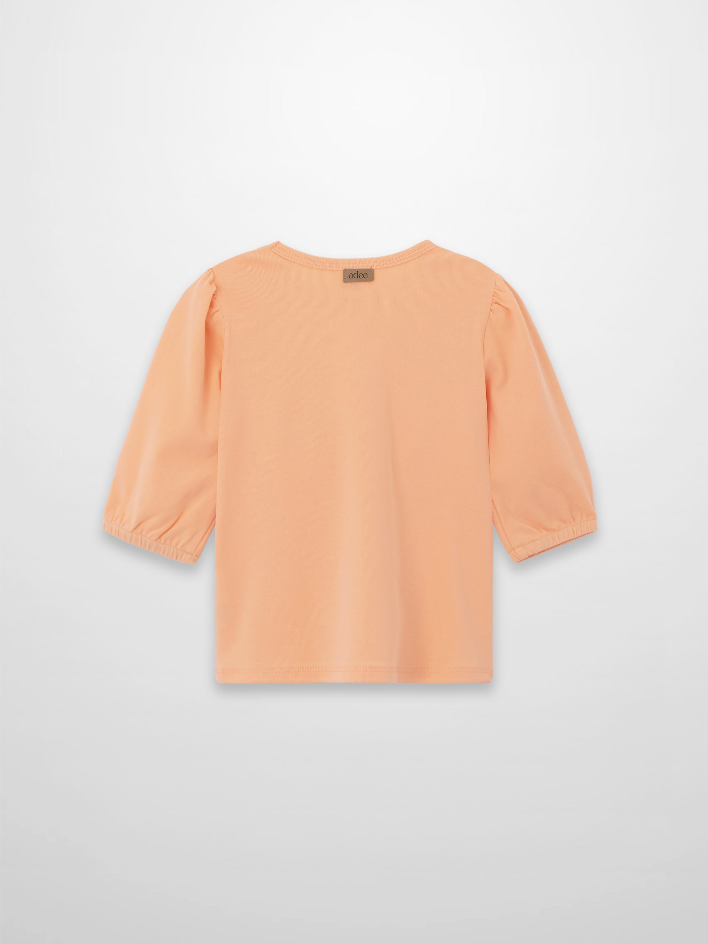Peach 3/4 puff sleeve T-shirt with gathered shoulders and elastic cuffs, back view.