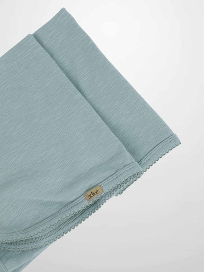 Blue Scalloped Blanket with subtle texture and delicate trim, lightweight and soft for baby’s warm-weather comfort.