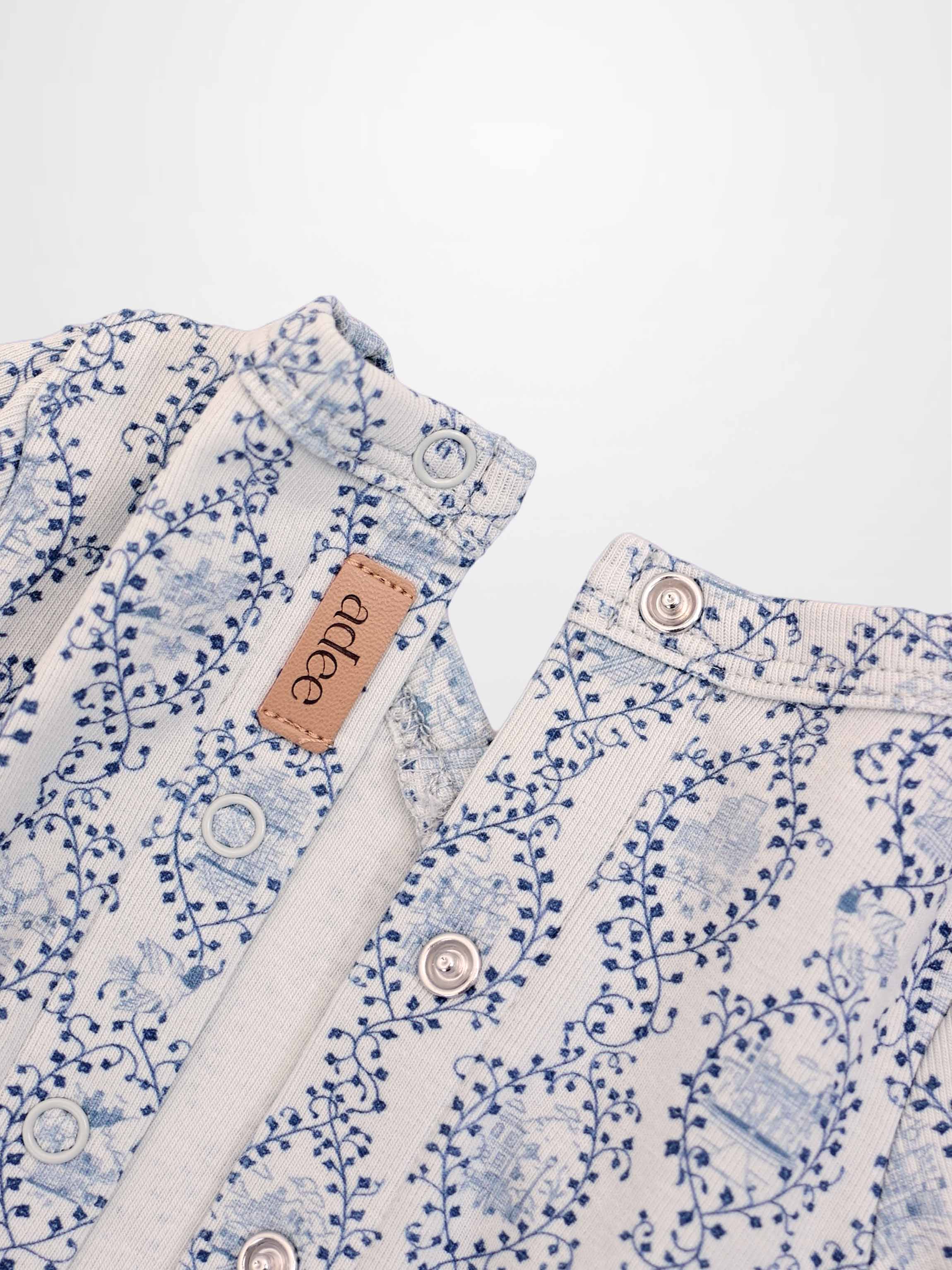 Blue Charm Stretchy boys stretchies by Adee featuring a pattern of dark blue vines.