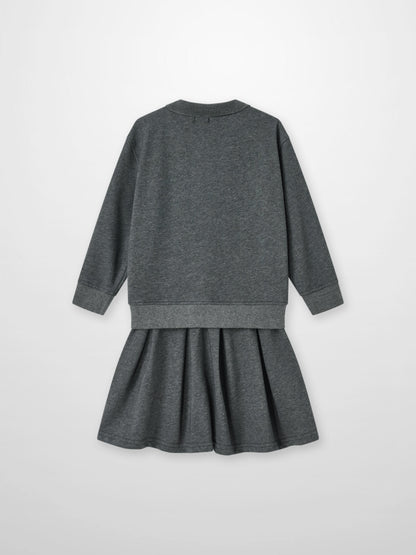Windsor Dress in gray heather with a sweatshirt-style top and pleated skirt.