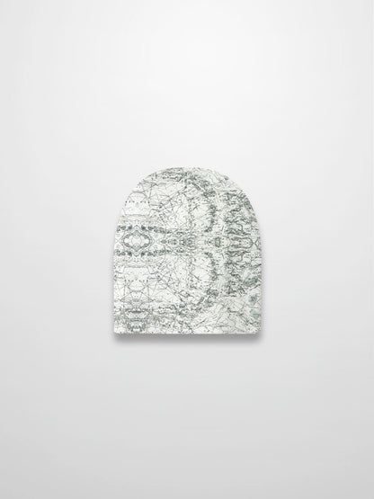 Map Beanie for baby boys with off-white fabric, map print, compass markers, and decorative stitching.