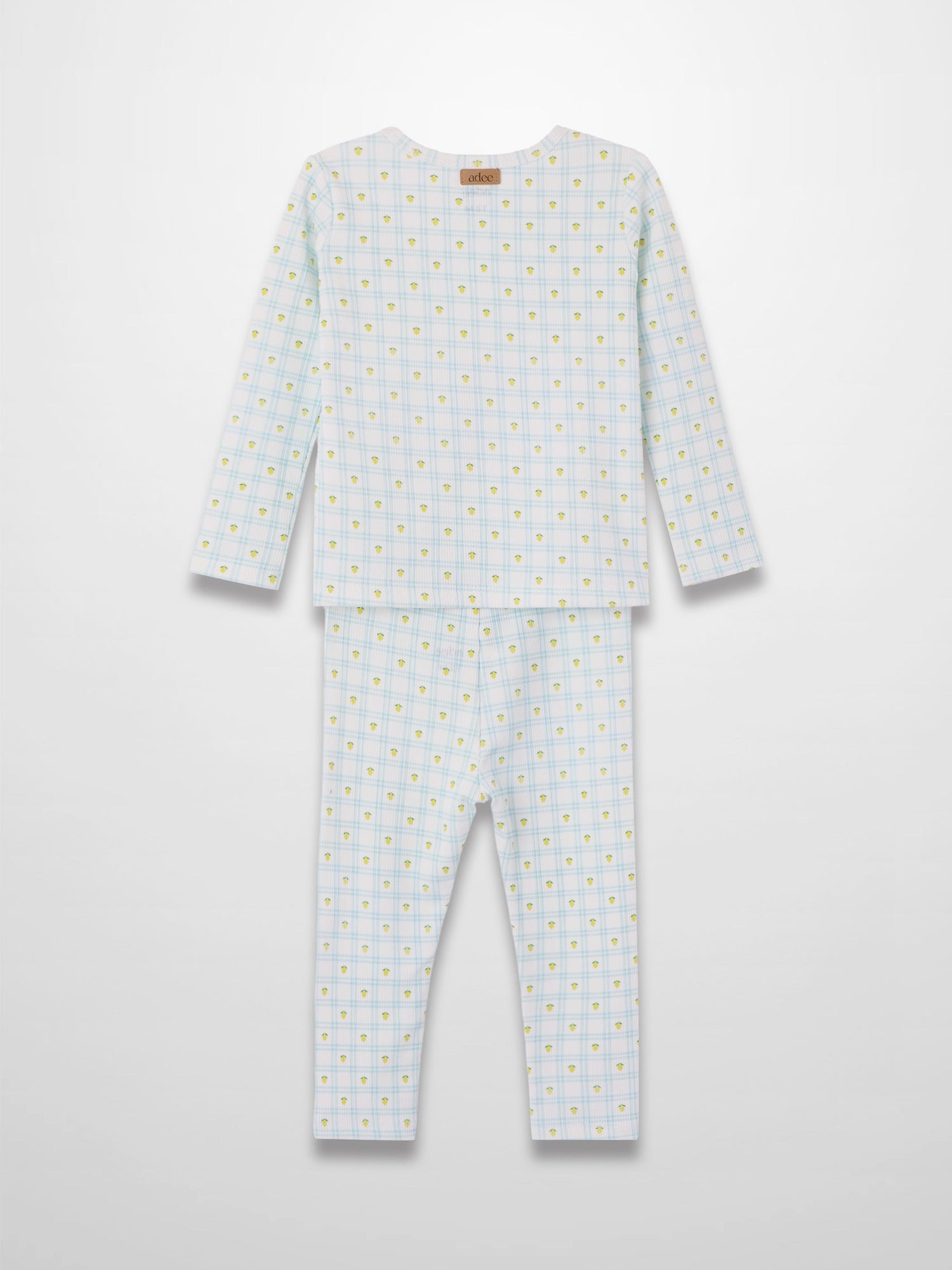 Lemon Window Pajamas: white base with light blue grid plaid and scattered yellow lemons, long-sleeve top and pants.