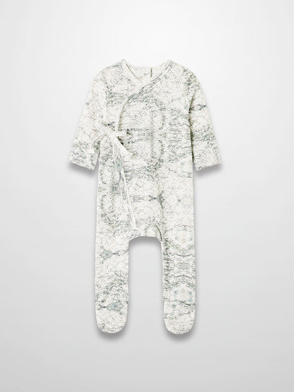Map Stretchy baby boy footie jumpsuit with off-white background, sage map print, compass markers, and crossover tie.