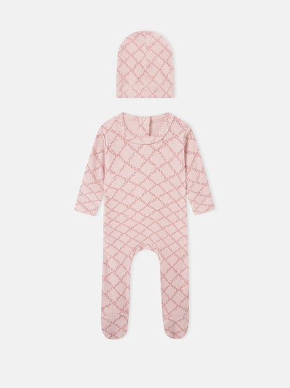 Adee Pink Leaf two-piece layette set for girls; knit hat and footed romper in pink lattice pattern.