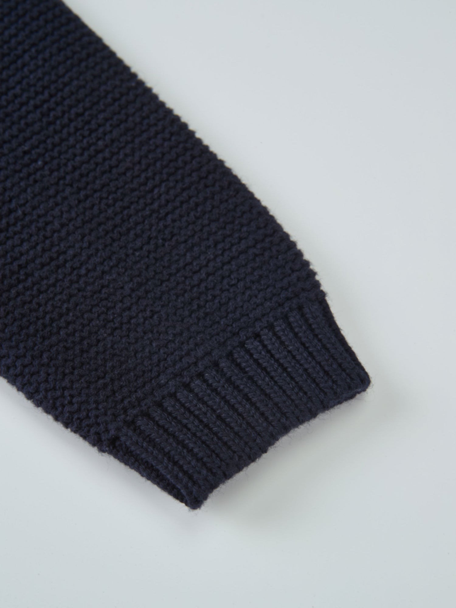 Cropped Cardigan navy knit by Adee; unisex dressy top.