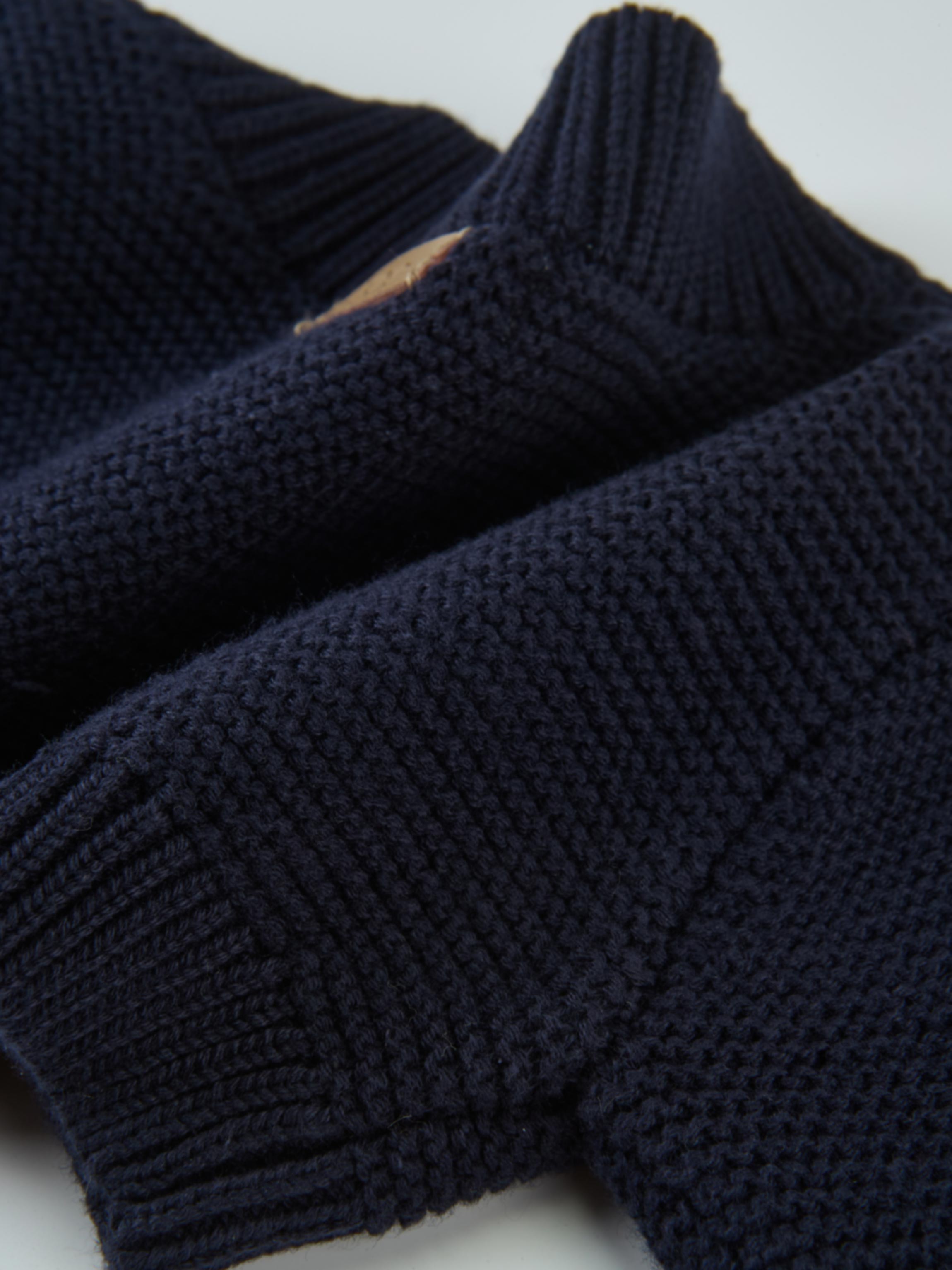 Cropped Cardigan navy knit with ribbed cuffs; unisex dressy top.