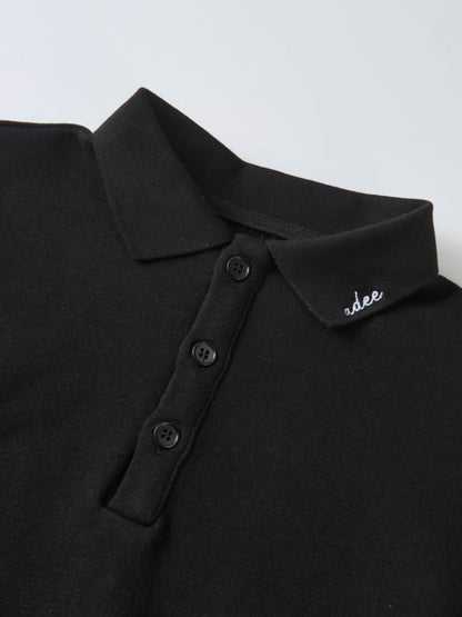 Collared black Adee polo-style sweatshirt, unisex top, with button placket and collar logo embroidery