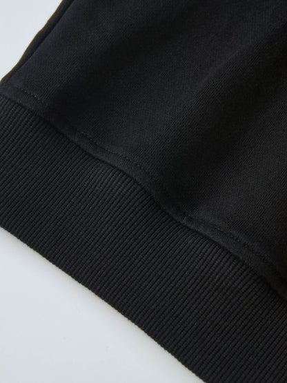 Collared Sweatshirt in black; close-up shows ribbed cuffs and smooth fabric.