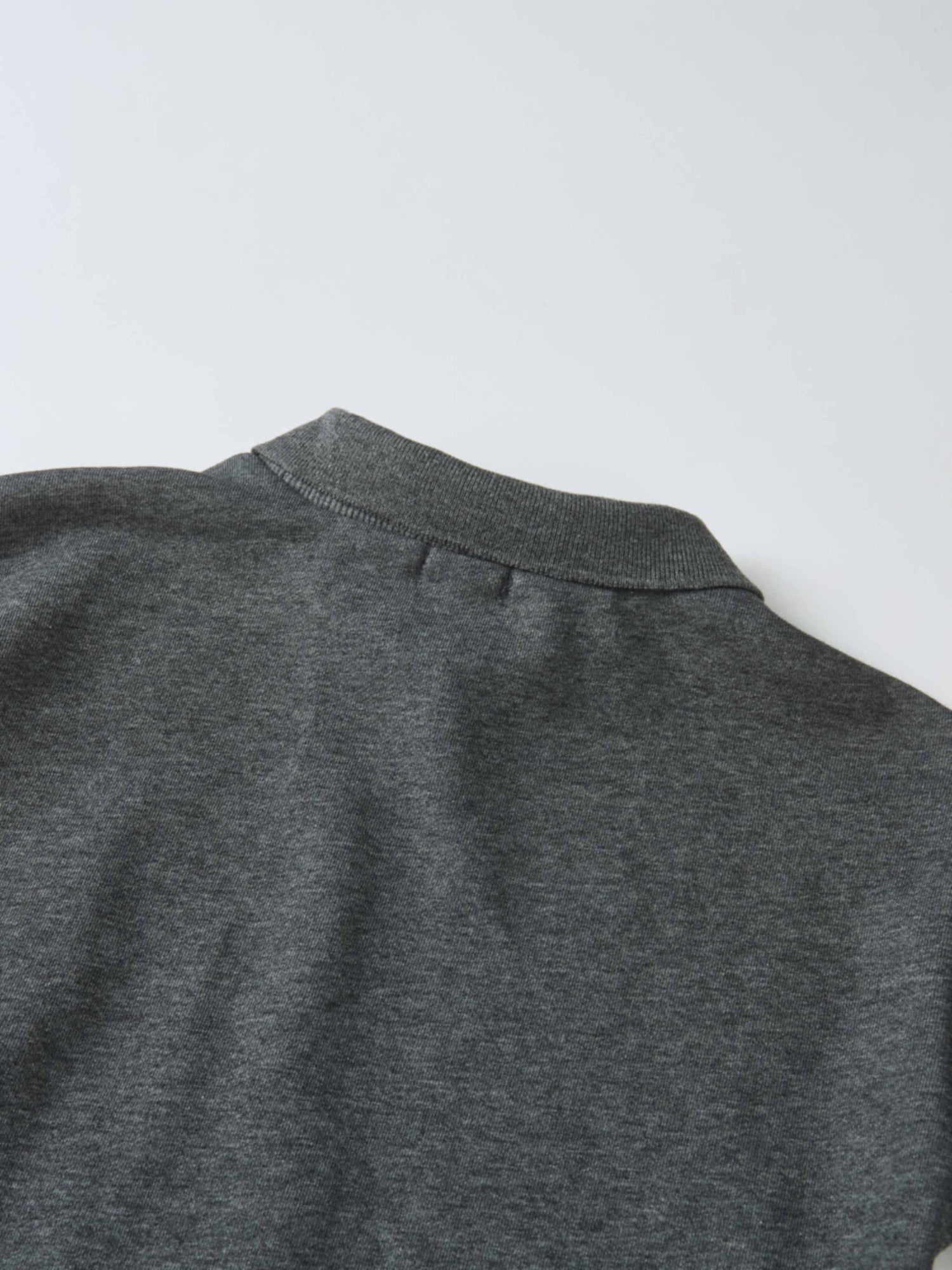 Windsor Dress, gray knit fabric close-up of a girls dress neckline.