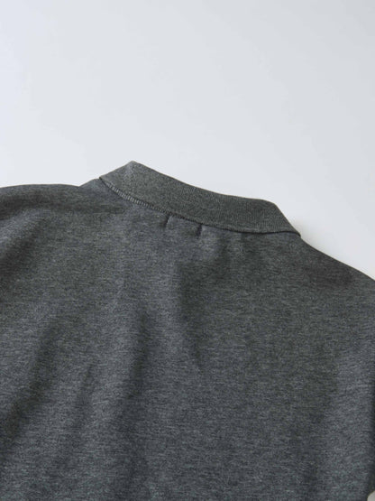 Windsor Dress, gray knit fabric close-up of a girls dress neckline.