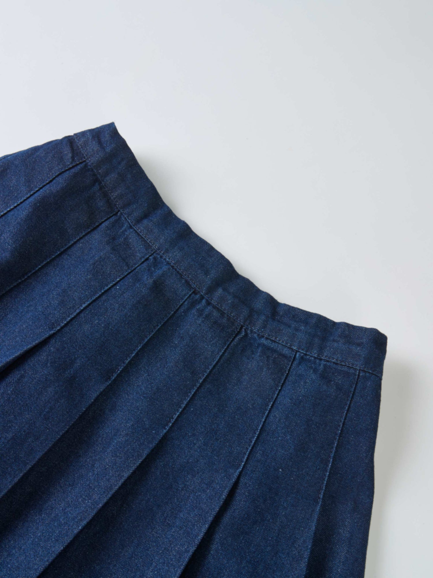 Girls denim pleated skirt by Adee in dark blue fabric