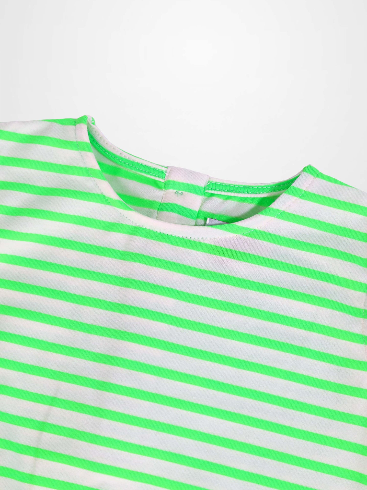 Neon green and white striped romper close-up at neckline.