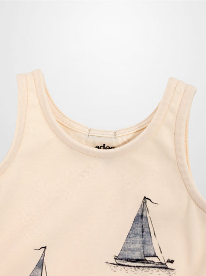 Peach Sail Boat Romper for babies with navy sailboat print, sleeveless.