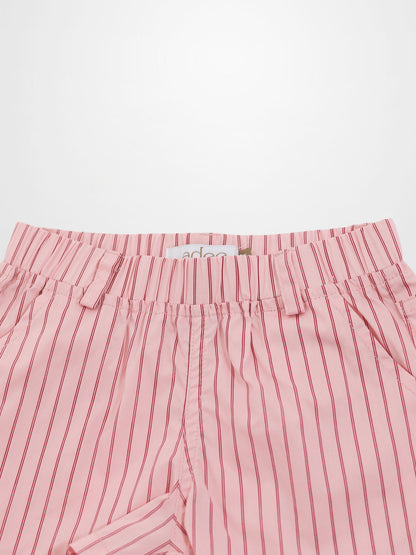 Pink cotton shorts with thin red vertical stripes, elastic waist, and belt loops.