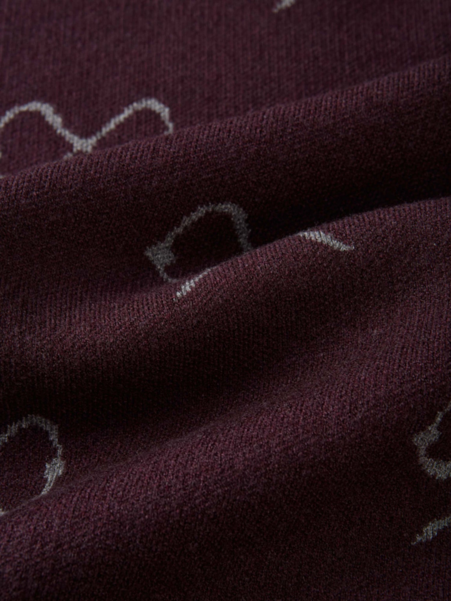 Bow Knit Sweater by Adee, burgundy knit fabric with white bow pattern