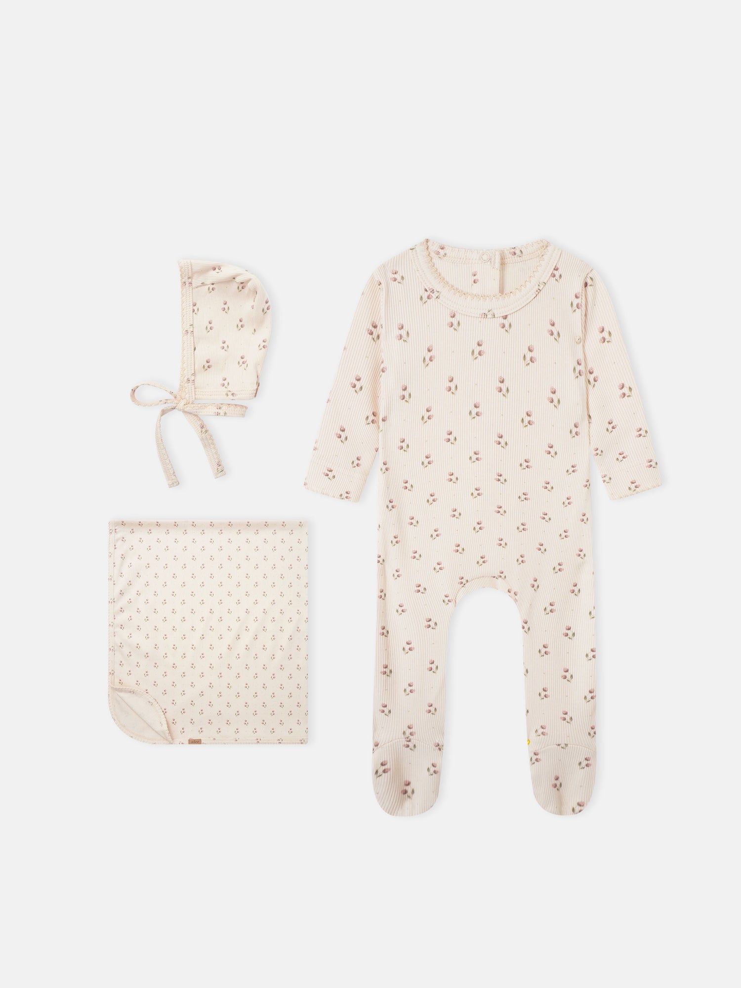 Tiny Tulip layette set: cream ribbed floral print for girls, includes a onesie, hat, and blanket.