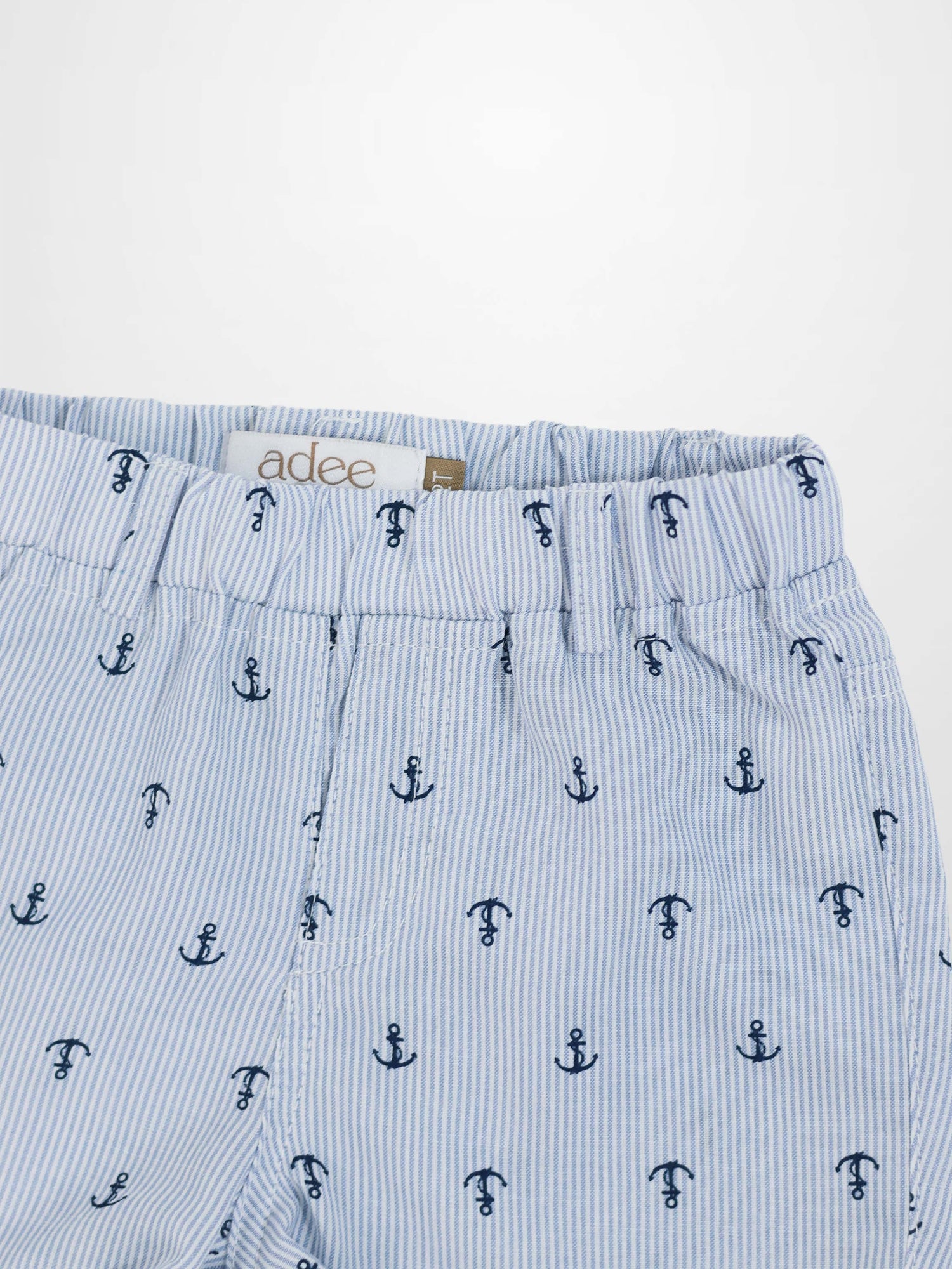 Anchor Shorts with light blue stripes and navy anchor print, elastic waistband.