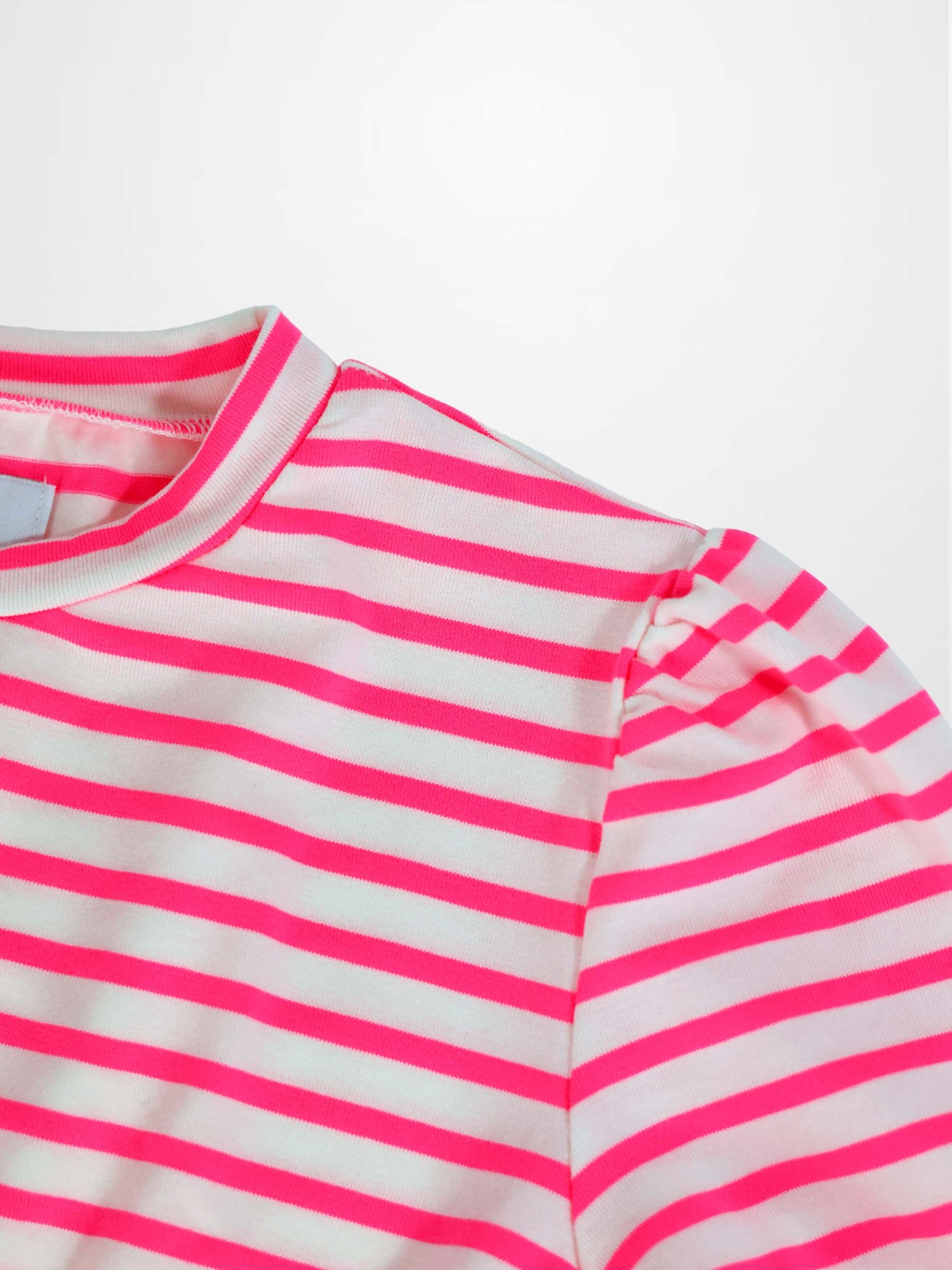 Neon pink and white striped dress with a rounded neckline and gathered 3/4 sleeves, close-up shoulder detail.