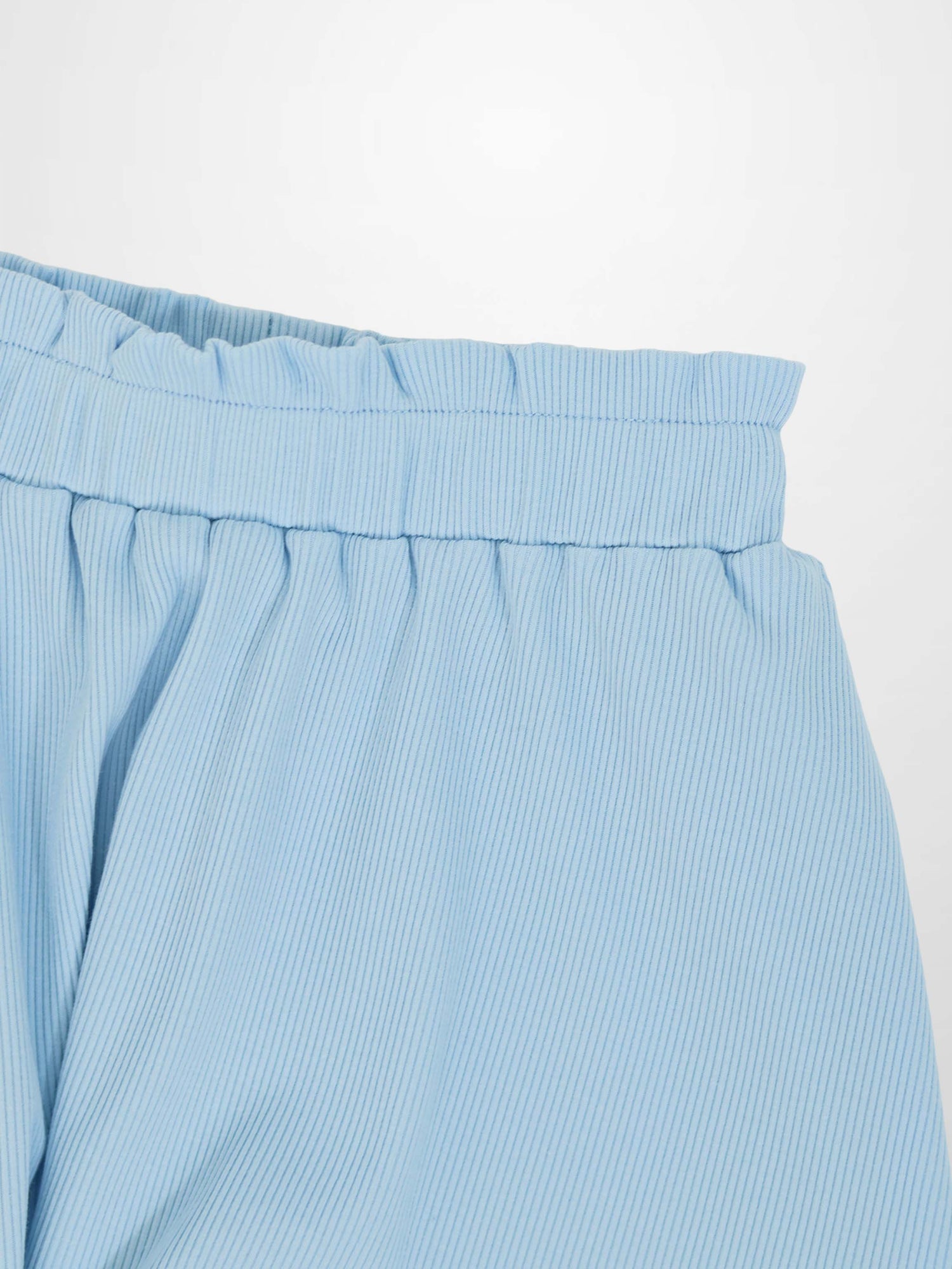 Light blue paper bag waist skirt with elastic waistband and diagonal stripe fabric.