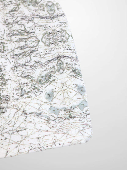Map Beanie for baby boys, off-white with a fine map print, compass markers, and decorative stitching.