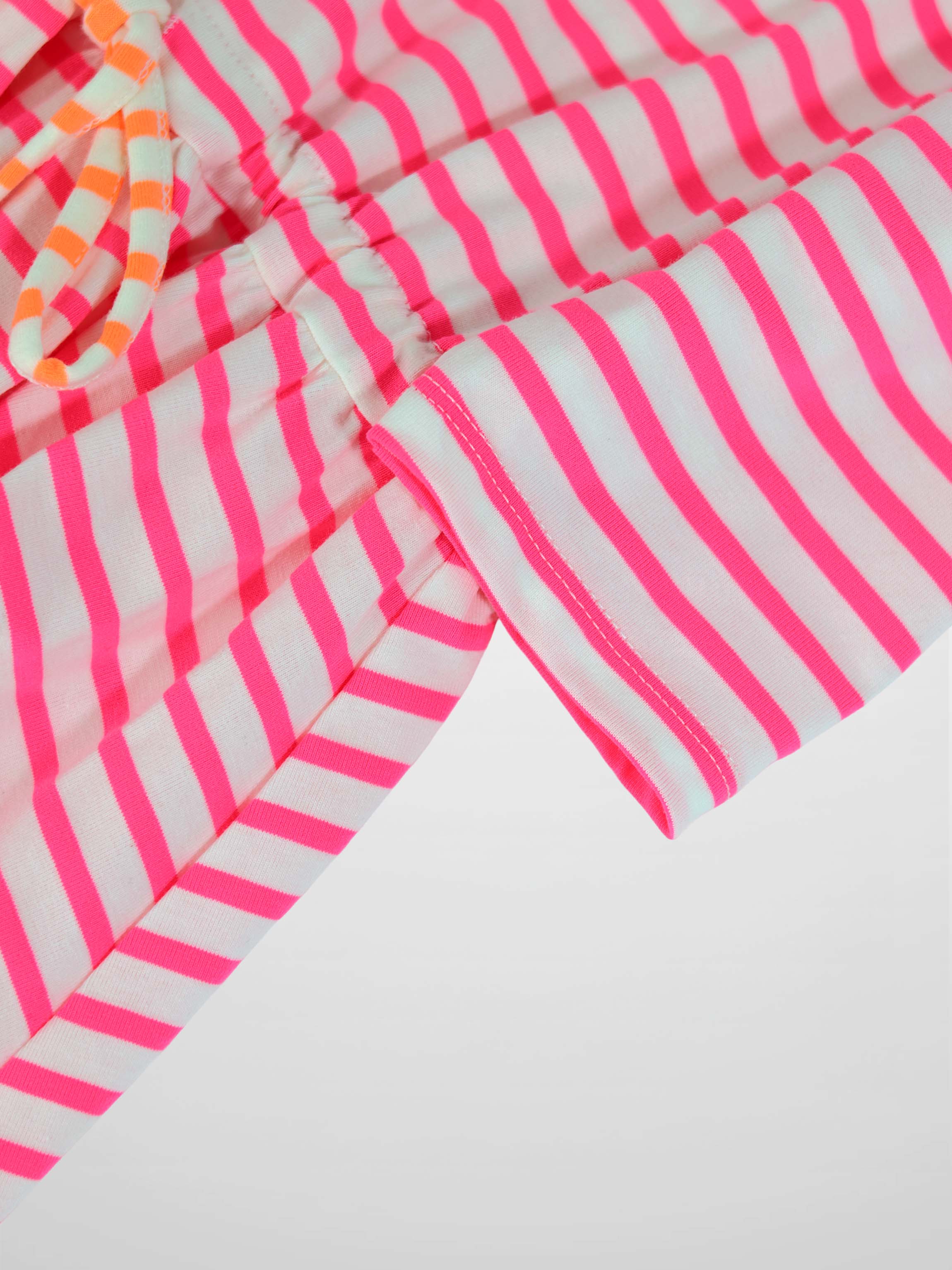 Neon pink and white striped dress with 3/4 sleeves and a gathered waist in knit fabric.