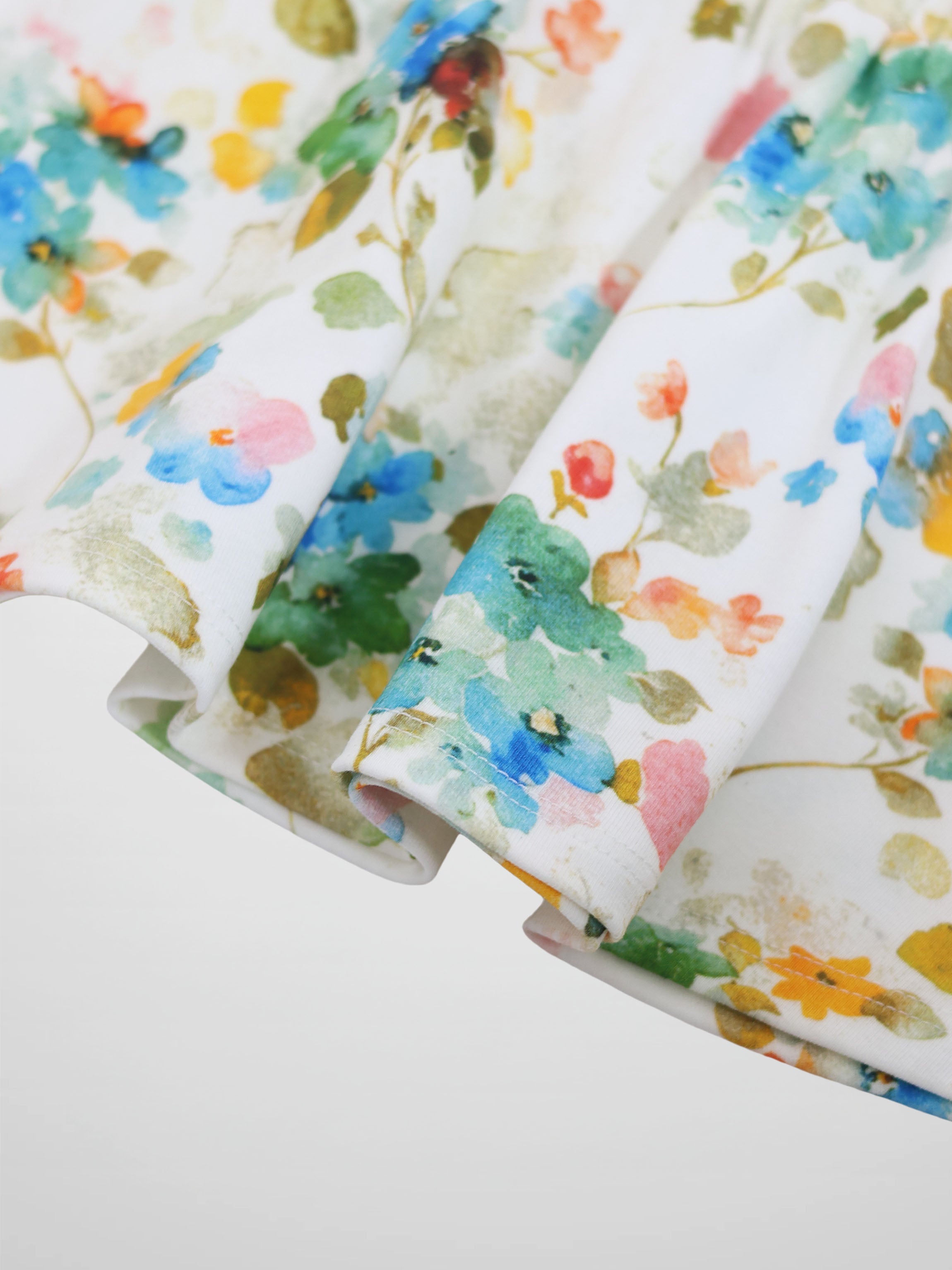 Pastel Flower Skirt with watercolor blossoms on white fabric.