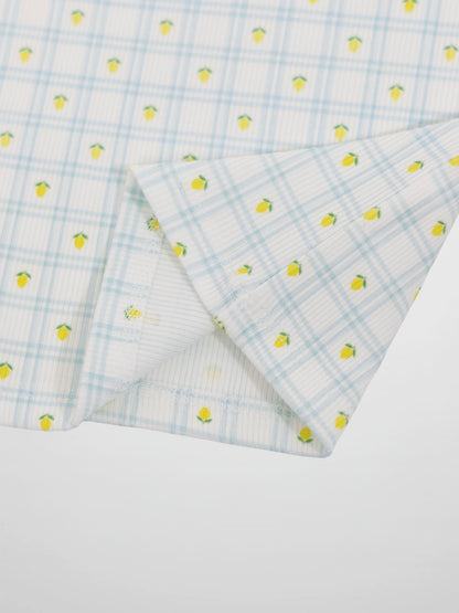 Lemon Window Pajamas fabric close-up: white base with light blue grid plaid and tiny yellow lemons.