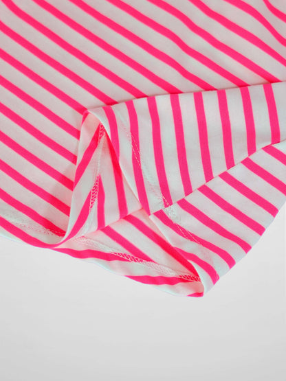 Neon pink and white striped fabric from a short-sleeve dress, with visible stitching along the hem.